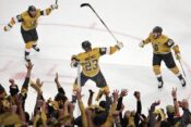 Alec Martinez #23 of the Vegas Golden Knights is congratulated by Jonathan Marchessault #81 and Ivan Barbashev
