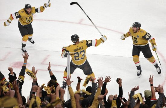Alec Martinez #23 of the Vegas Golden Knights is congratulated by Jonathan Marchessault #81 and Ivan Barbashev