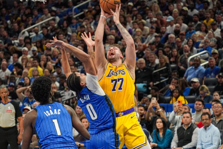 Orlando, Florida, USA, March 24, 2025, Los Angeles Lakers guard Luka Doncic #77 attempt to score during the first half at the Kia Center. (Photo Credit: Marty Jean-Louis/Alamy Live News