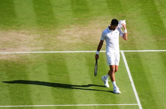 Novak Djokovic reacts during his Gentlemen's Singles semi-final match against Jannik Sinner on day twelve of the 2025 Wimbledon Championships at the All England Lawn Tennis and Croquet Club, London. Picture date: Friday July 11, 2025.