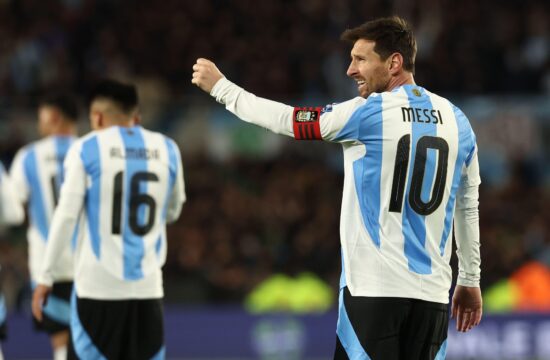Argentina's forward Lionel Messi (R) celebrates after scoring the team’s third goal during the South American qualification football match between Argentina and Venezuela for the FIFA World Cup 2026 at the Monumental stadium in Buenos Aires on September 4